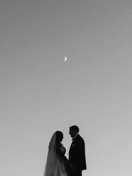 Tsion and Ben stand looking at each other under the moon. 
